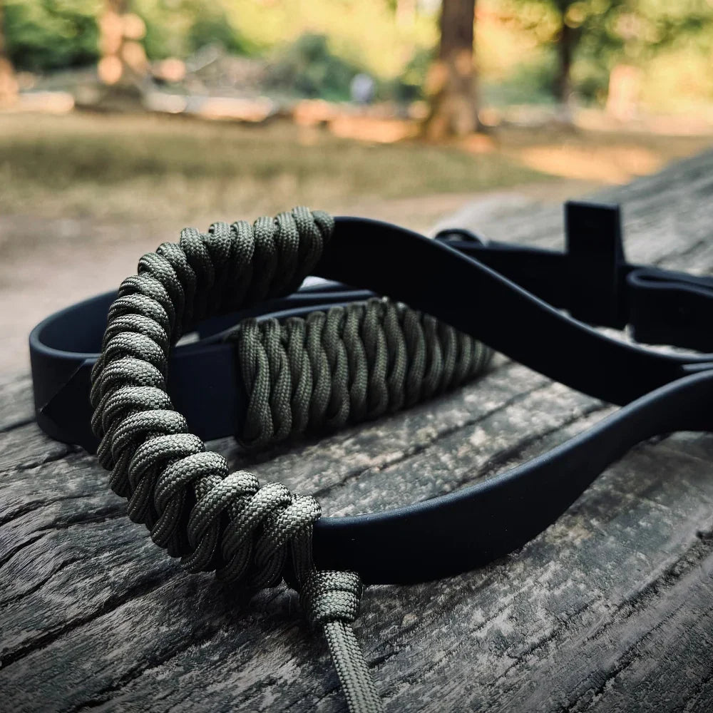 Handmade dog lead made from rPET rope and Biothane resting on a wooden surface outdoors