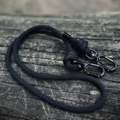 Black rPET rope dog lead with Biothane hardware on wooden surface