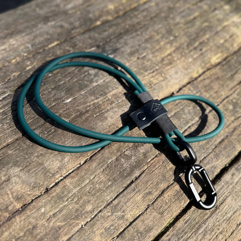 Handmade rPET rope and Biothane dog lead with strength tested hardware on wood